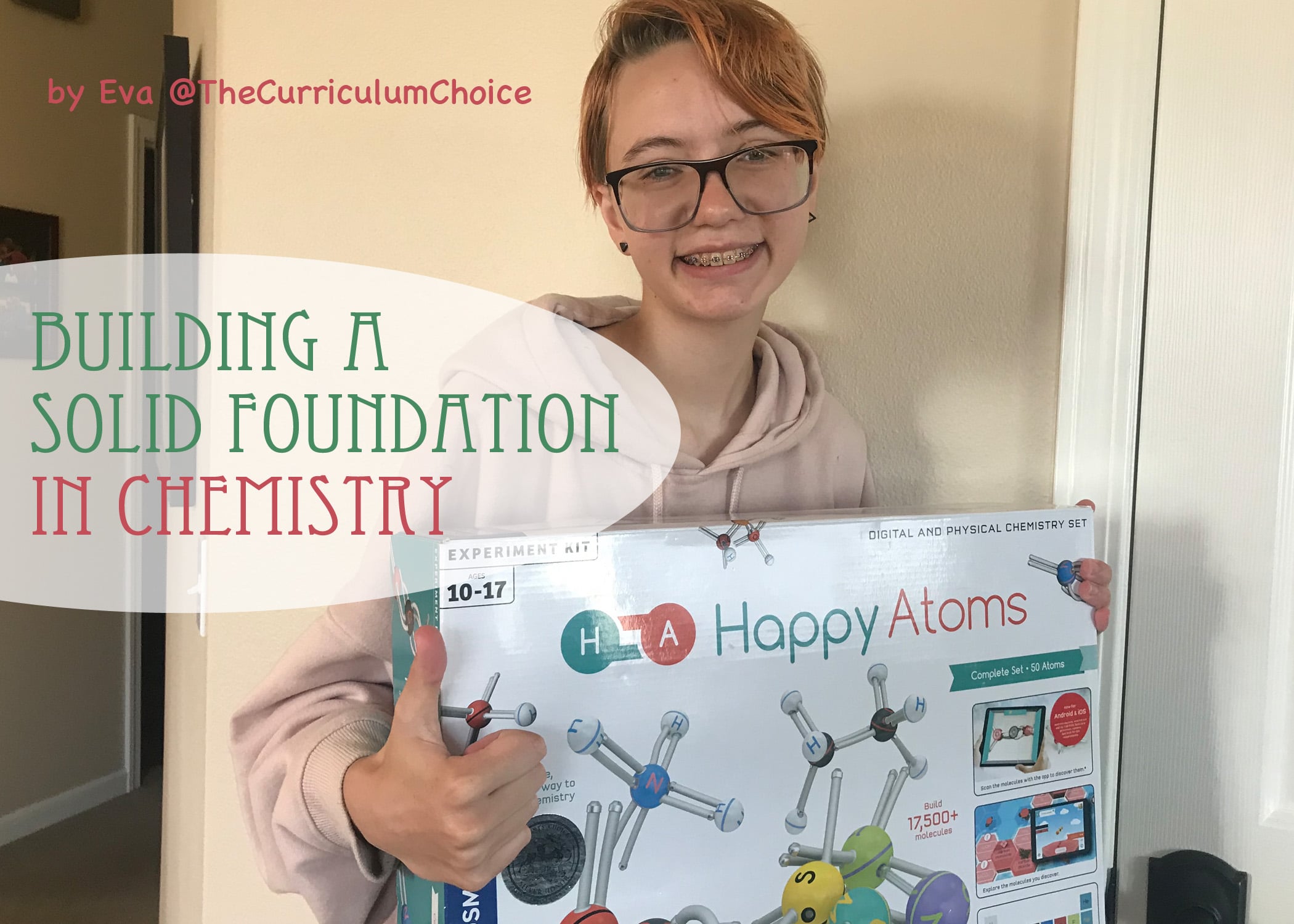 image of teen with Happy Atoms model kit 